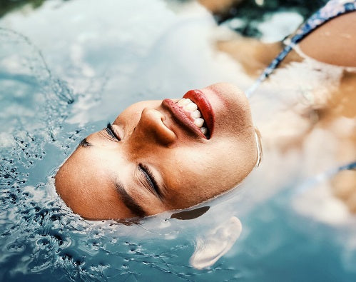 woman hydrating her skin naturally